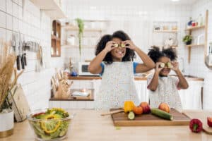 Two little black girls cooking
